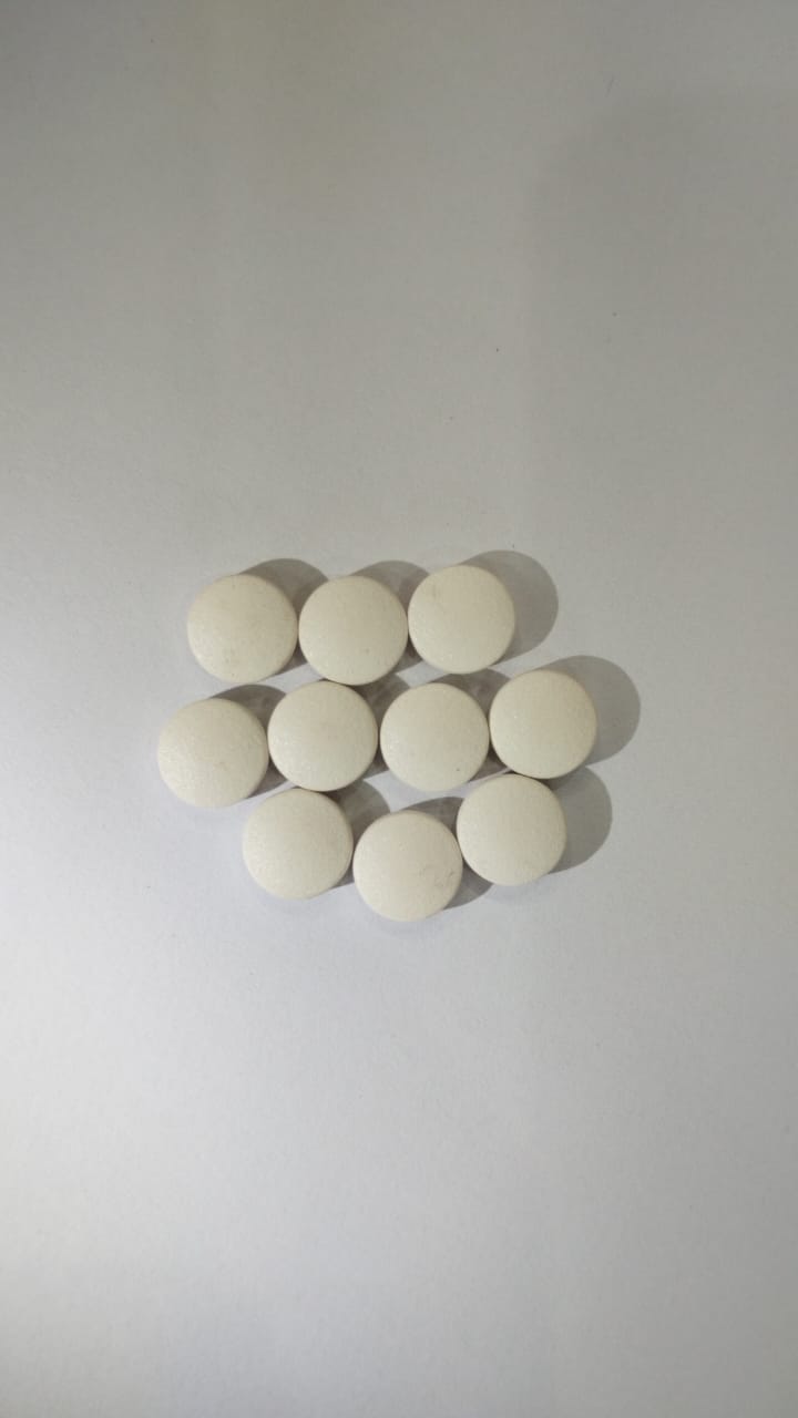 White film coated round tablets